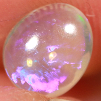 SOLID CRYSTAL OPAL Transparent with rich purple sparkles